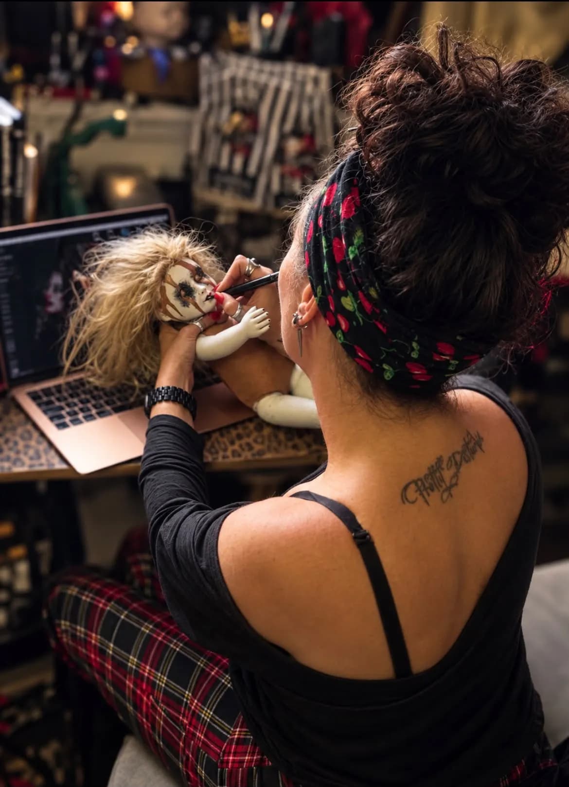Leesa Bertram O'Neill puts the finishing touches to a doll